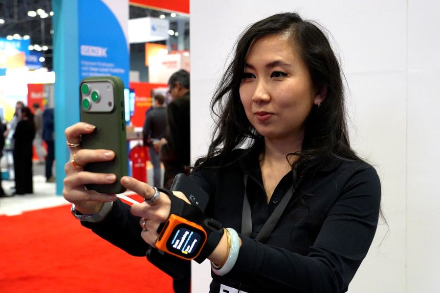 Attendee taking a selfie at a trade show booth