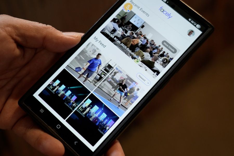 Phone showing an event photo feed in the Facely app